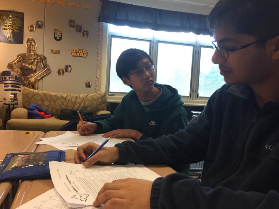 Freshman Akash Bhowmik and Nathan Huang work on practice problems in preparation for the AMC competition. The competition will be on Feb. 7 and Feb. 13 during the school day.