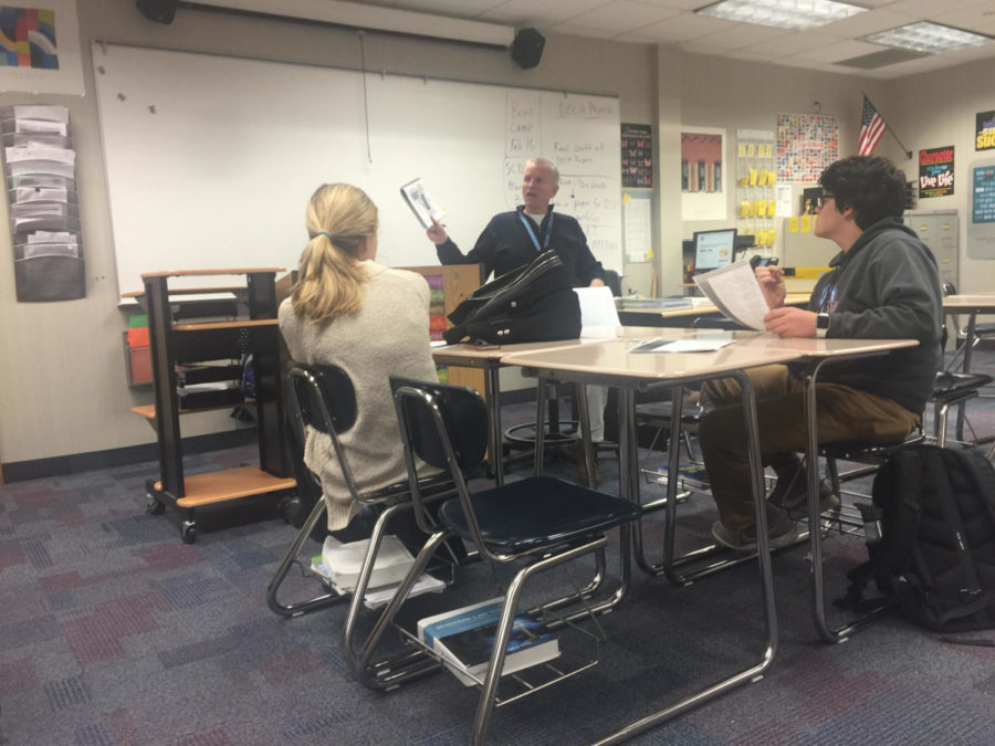 Zoe Edwards, Mock Trial witness and sophomore, reviews judges’ comments during a practice. “I have complete confidence in my lawyers and the other defense witnesses,” Edwards said.