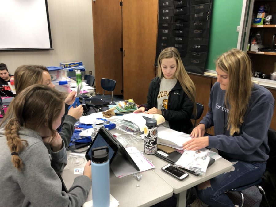 (Right to Left) Juniors Maddison Grave, Ellie Esrael, Aeryn Hopwood, and Livvie Miller work on teaching props to accompany their lesson plans during a G4 Kid’s Corner class on Feb. 22, 2019.