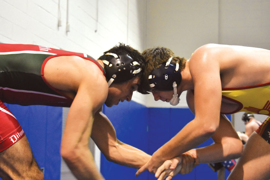 Head to head: Wrestler and sophomore Jacob Smith goes against wrestler and senior Cameron Bacon during practice on Feb. 13. The wrestling team went to state on Feb. 16. 