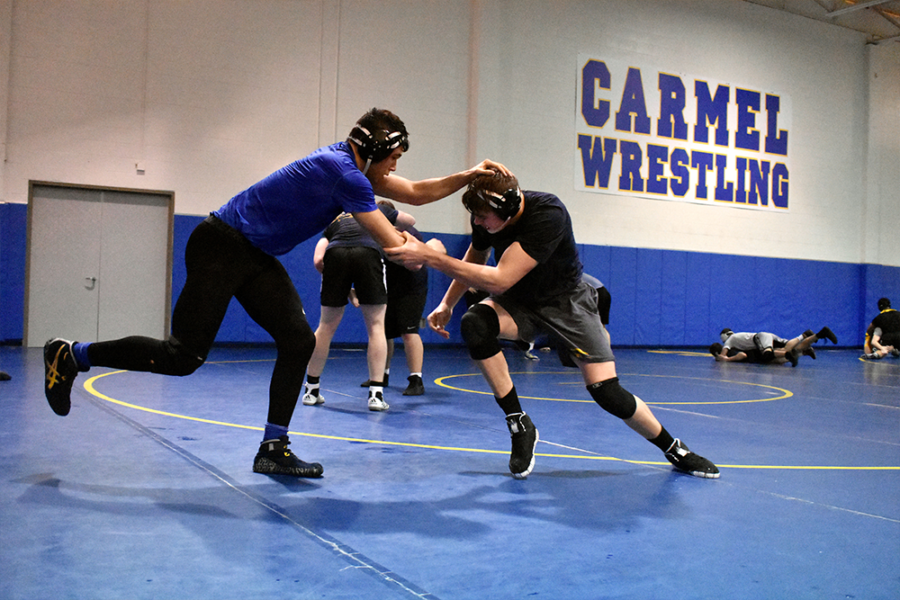 Wrestlers and seniors Jack Heldt and Cameron Bacon train with each other during wrestling practice after school in February. Heldt said as a senior, he had certain expectations for the season, and for the most part, he said he met them.