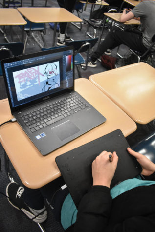 TEACH SAVVY: Renay-Lopes works on a commissioned art piece using his tablet. Renay-Lopes said he has been commissioned multiple times to create different pieces of digital art and character designs.