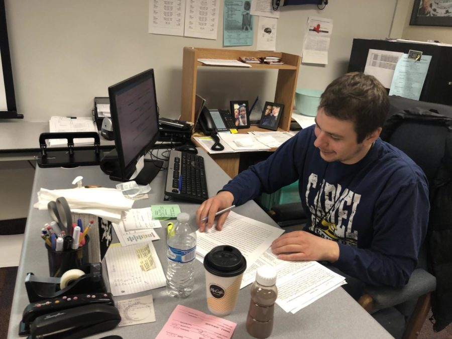 James Ziegler, Academic Super Bowl co-sponsor and social studies teacher,  creates an agenda for the Academic Super Bowl team for its upcoming  meet at Ben Davis. According to Ziegler, the competition can take up to five hours. 