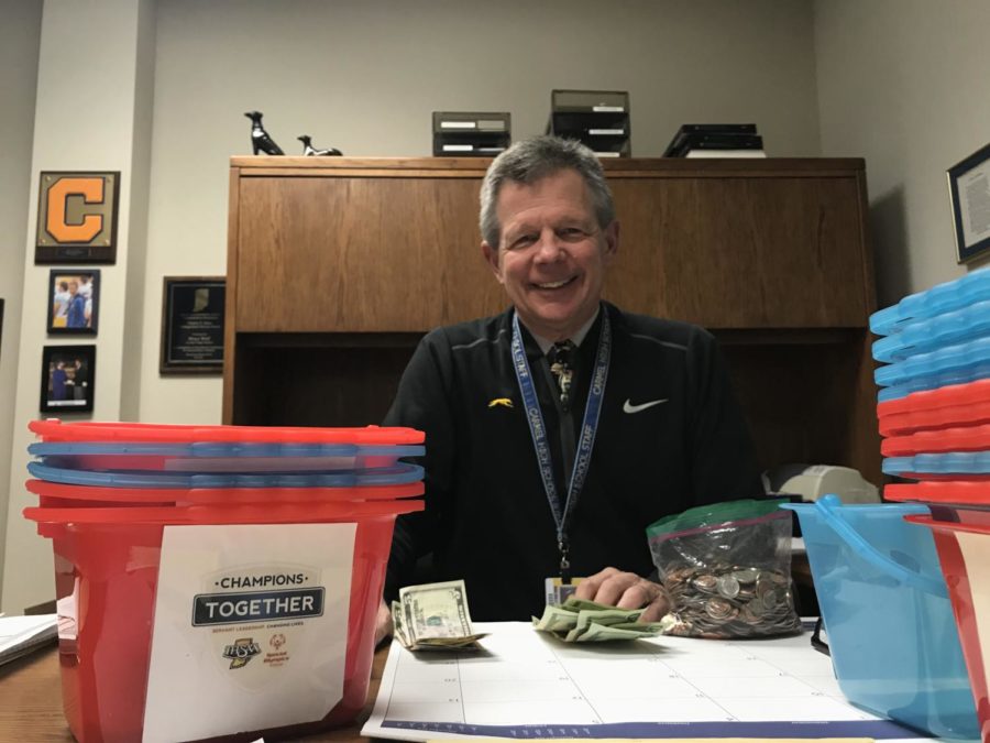 Bruce Wolf, Champions Together co-sponsor and assistant athletic director, counts the money the club raised at their annual Mr. Carmel event in 2019. Wolf said starting Champions Together with Joe Stuelpe was one of his proudest moments across his 40 year CHS career.