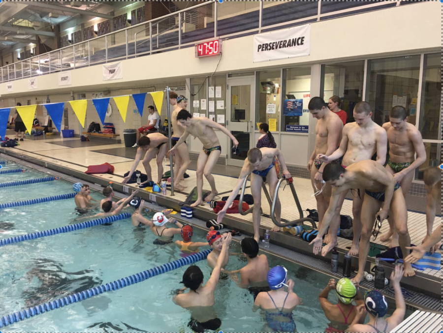 Both swimming teams finish a time trial during the evening practice. “We usually have boys’ and girls’ practice together,” Plumb said.
