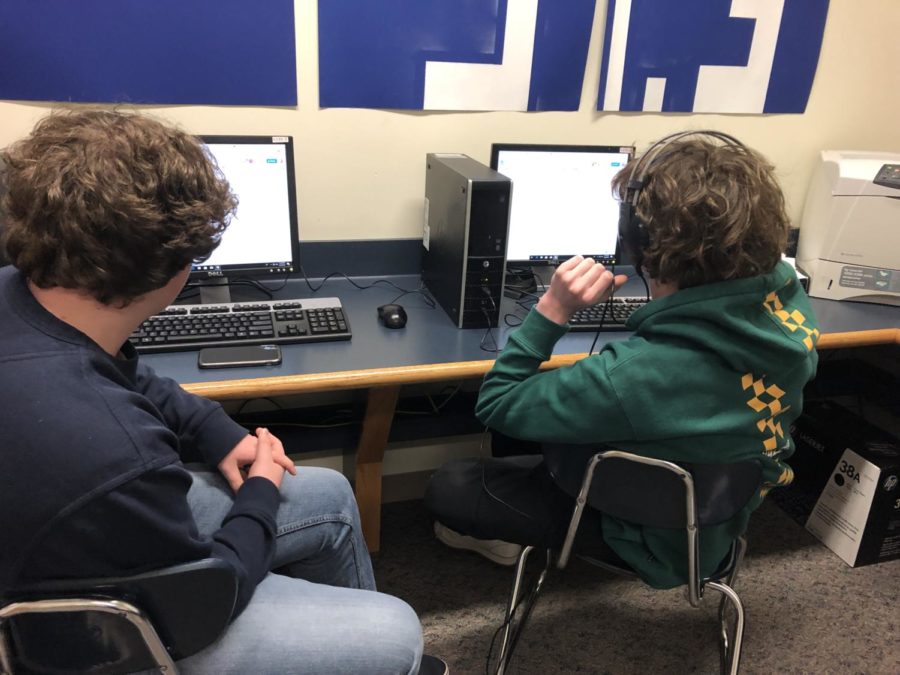 In the computer lab, freshmen Tanner Rindfuss and Aidan West prepare their scripts for their first broadcasting session.