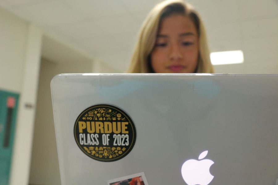 Senior Tori Ledezma displays her Purdue sticker on her laptop while working. Ledezma has committed 
to Purdue University, following the path of her parents.
