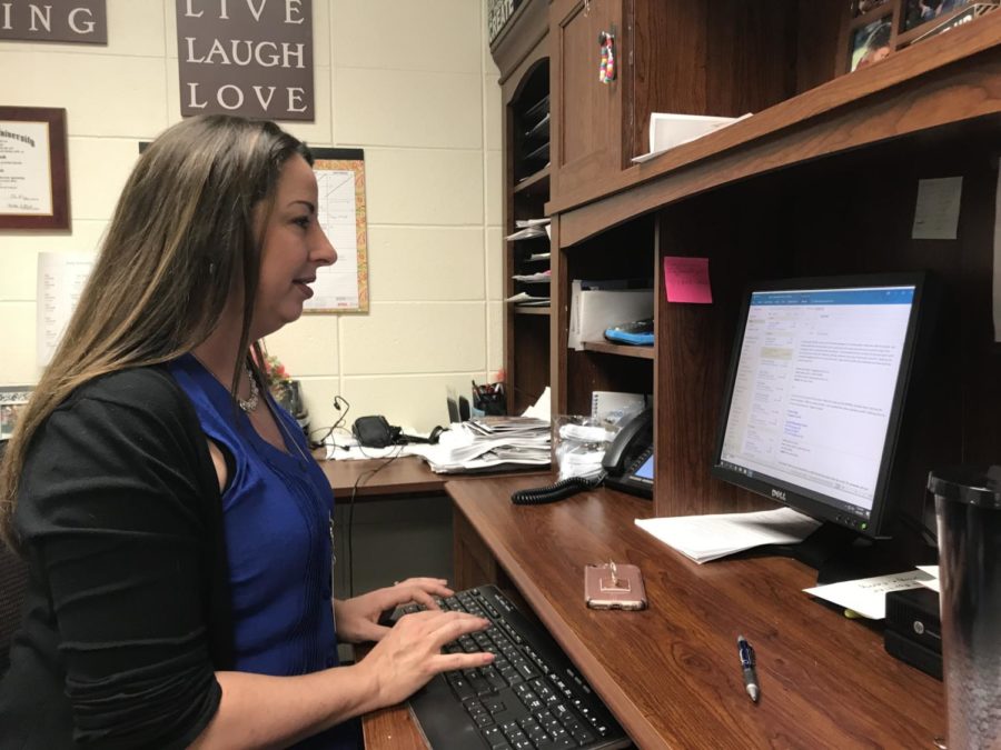 Director of choirs Katherine Kouns responds to an email from her daughter’s teacher in her office on April 8. Her daughter is a fourth grader at Carmel Elementary, and is a part of the school’s film club. 