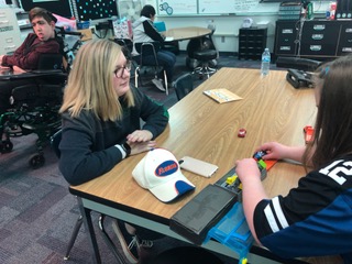 Molly Crosby, Best Buddies member and freshman, talks to her buddy during SRT. Crosby has been involved with Best Buddies since she started middle school and is excited to participate in her fourth Best Buddies Friendship Walk this year.