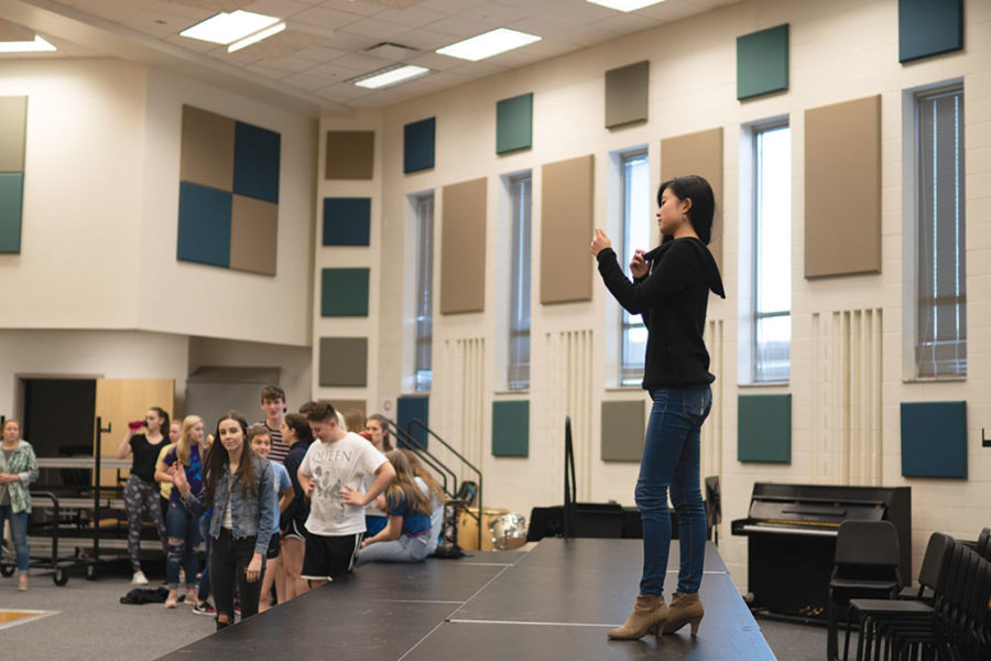 Chendi Liu, student director of “Bring It On” and junior, gives advice to performers during rehearsal. She said having female directors allows for everyone to express their opinions.