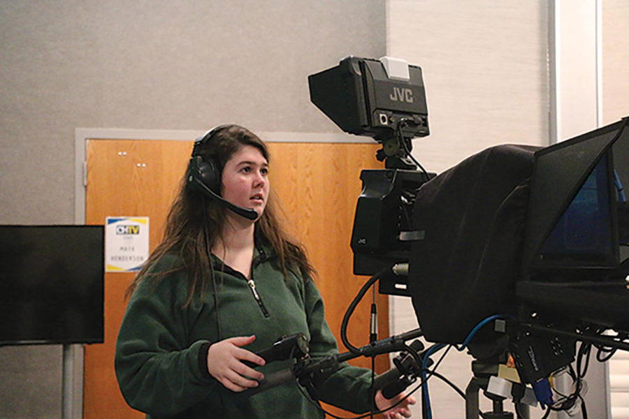 Maria Saam, CHTV Director and senior, adjusts the camera angle during the morning SRT show. Saam is one of the main directors and in charge of stage setting, lighting and audio 
cuts during 
the show.