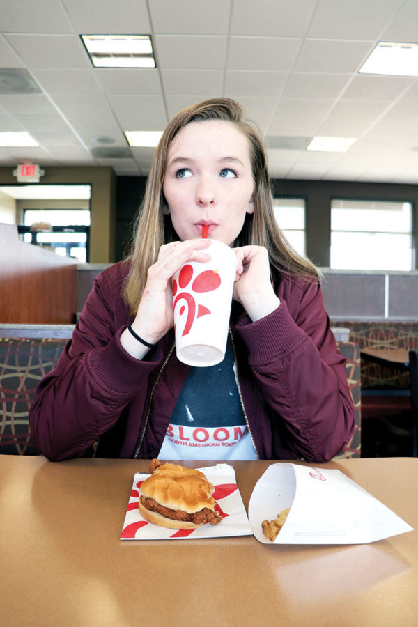 Sophomore Anna Thompson eats at a local Chick-fil-A. Thompson said that while the boycotting the company sends a message, she feels that it is not on a large enough scale to be effective.