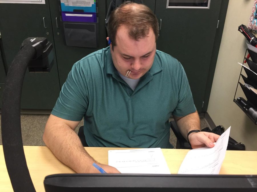  Joseph Broman, sponsor and math teacher, looks at possible competitions for the next school year. The Math Club members said although there are no more upcoming competitions for this school year, they have begun preparing for competitions next year. 