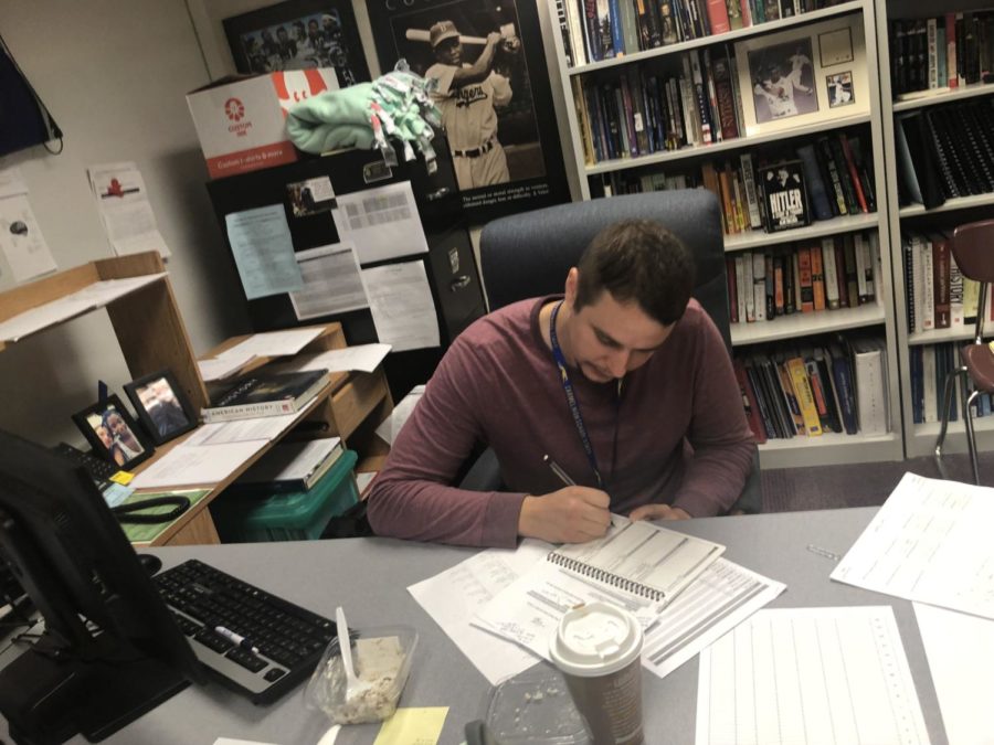 James Ziegler, Academic Super Bowl co-sponsor and social studies teacher, prepares  for  upcoming Academic Super Bowl call out meeting. Ziegler said this meeting will be during the first week of September. 