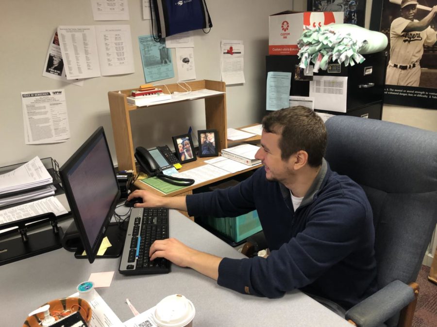 James Ziegler, Academic Super Bowl co-sponsor and social studies teacher, marks upcoming Academic Super Bowl call-out meeting on his calendar. Ziegler said this meeting will be on Sept. 26 in Room E225.