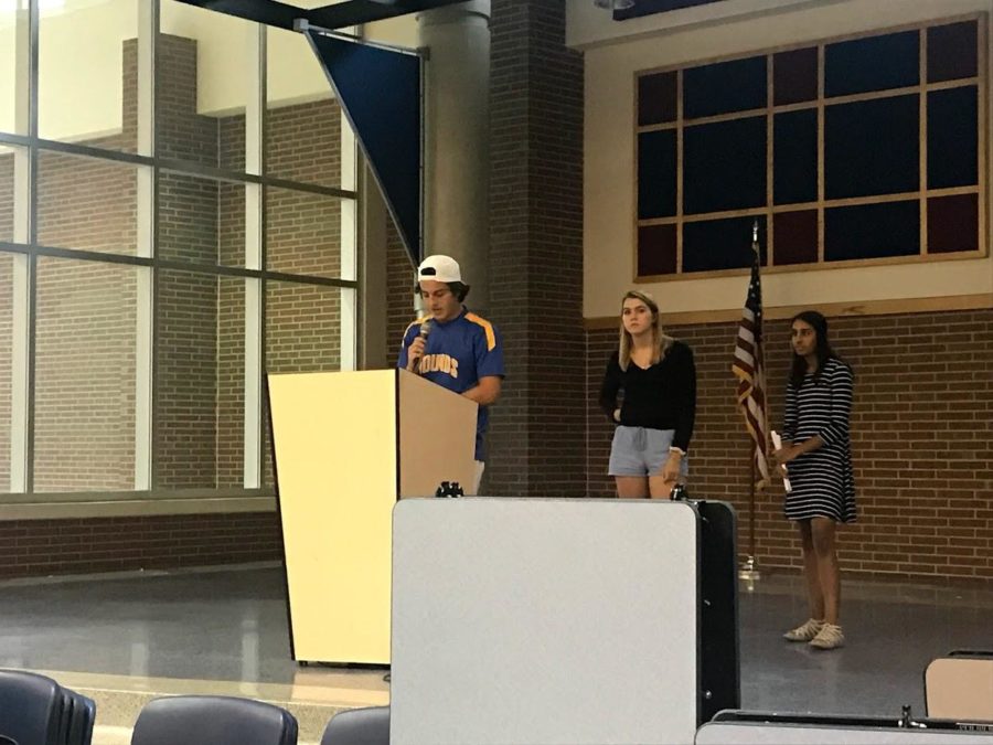 (Picture left to right) NHS president Kieran Thompson, NHS vice president Emme Walschlager, and NHS business manager Parul Gupta explain to NHS members how to sign up for the club’s Remind page and how they can begin fulfilling their volunteer requirements. This year, NHS members are required to curate 40 hours of community service.