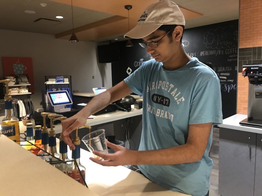 Senior Abinay Devarakonda makes a drink in the Carmel Café during SRT. Devarakonda said, Im most excited to go to ICDC this year because I went last year and it was a really good experience.