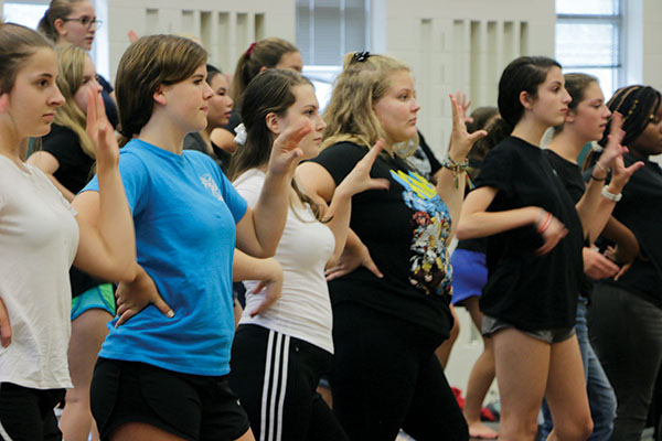 LEARNING CHOREO:
Sophomore Meg Shaffer (left), junior Lindsay Vrobel (middle) and sophomore Ava Reynolds (right) practice the choreography in class. Vrobel said Allegro will learn new choreography this year to perform 
at concerts.