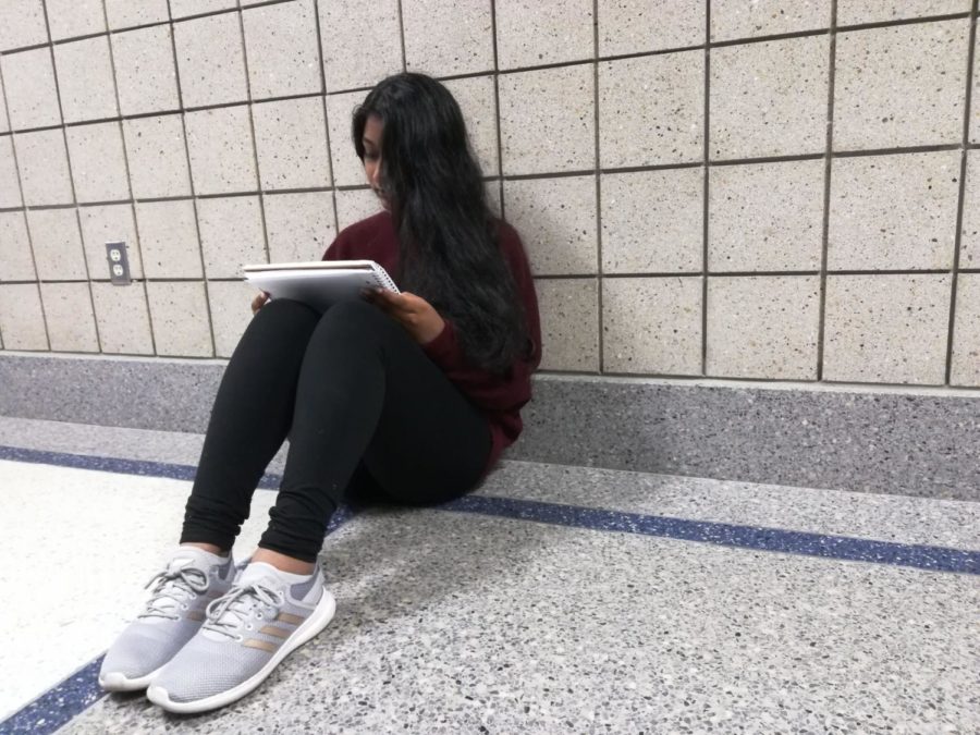 Sophomore Manasa Kesa looks over her notes for AP European History and decides whether or not to register for the exam at the end of the year. AP exam registration will begin Oct. 14 and end Oct. 27. 