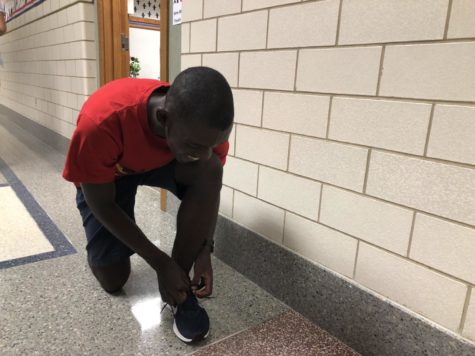 Daniel Musapatika, cross-country runner and junior, prepares for practice. Musaptika said that the team has continued to improve, and still has high expectations for State. 