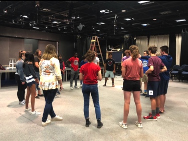 Comedy Sportz members gather in a circle formation to prepare for the start of their training session in the Studio Theater during the first session of their SRT period on Sept. 4. Comedy Sportz will have its next meeting on Oct. 18 in P123.