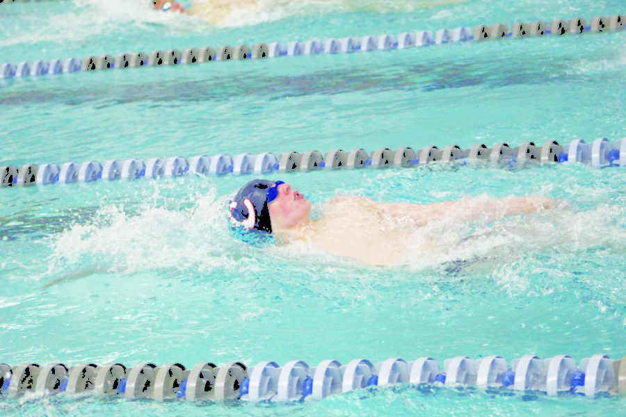 PRACTICE MAKES PERFECT:
Graham Seaver, men’s swimmer and sophomore, swims backstroke at the SSC Swim Fest meet on Oct. 6. Seaver said he has seen a rise in numbers for the swim team. He added that he believes the team’s successes at State and other meets have contributed to this growth.