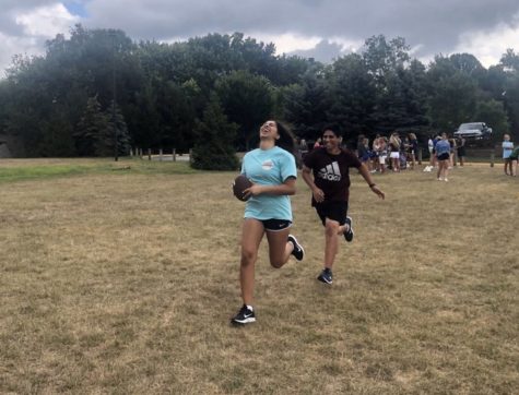 The United flag football team practices their plays for their next game. Partner and freshman Ryan Deldar said that his team played well against their opponents on Oct. 8 during Sectionals.