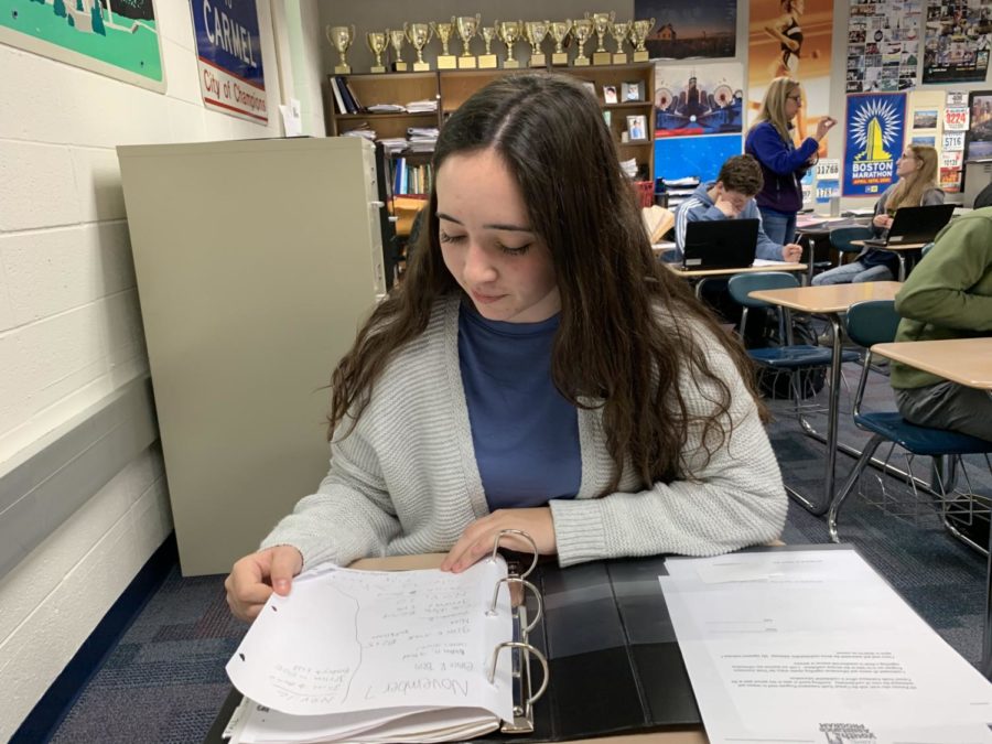 Nina Metaxas, Carmel Mayor’s Youth Council (CMYC) vice president and senior, looks at her binder during SRT. Metaxas said CMYC is working hard to plan their holiday events, Toy Drive and Kid’s Booth, both of which will take place during the first week of December.
