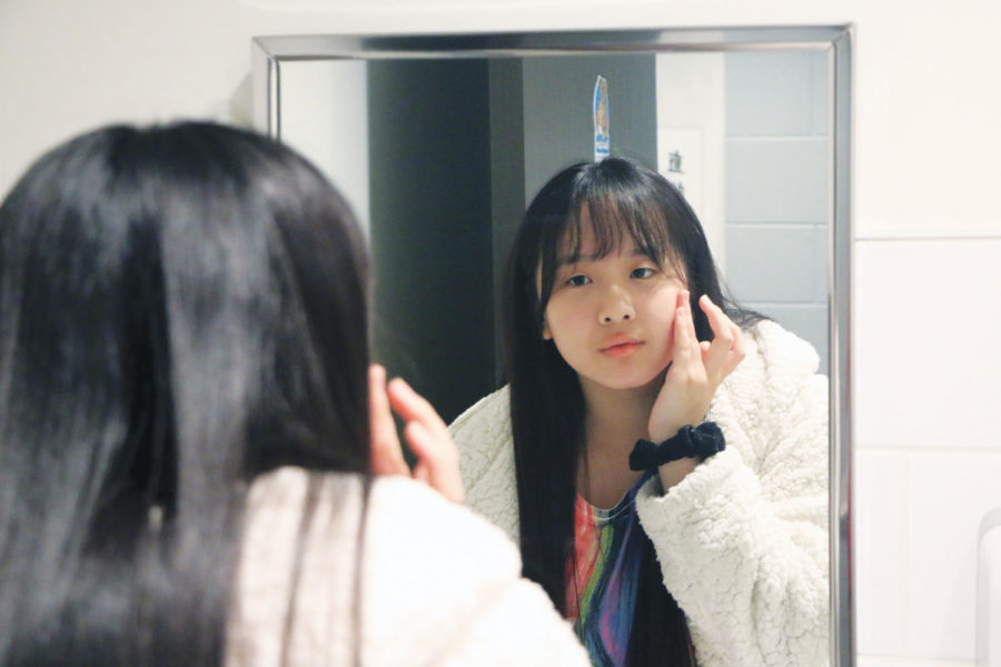 As part of her skincare routine, Senior Hannah Liu applies Blanc De La Mer cream, a facial hydrating mask used to moisturize and brighten the skin. Liu said skincare is an important part of her self care routine. Another thing that she chooses to incorporate in her life for self care is exercise, specifically dancing.