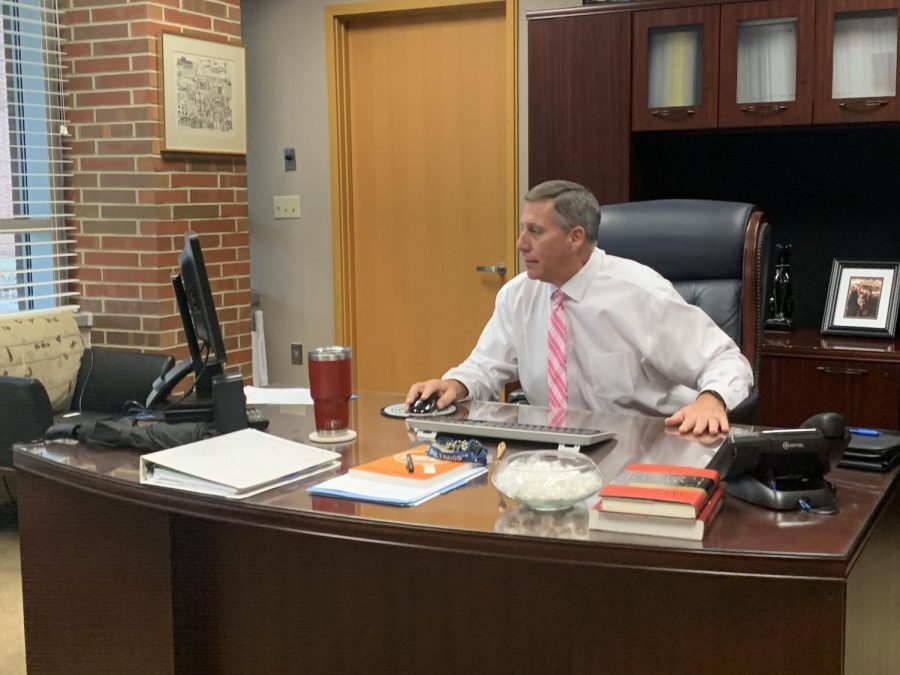 Principal Tom Harmas works at his desk. He said that Academic Transition Night is a great opportunity for eighth graders to learn more about the school.