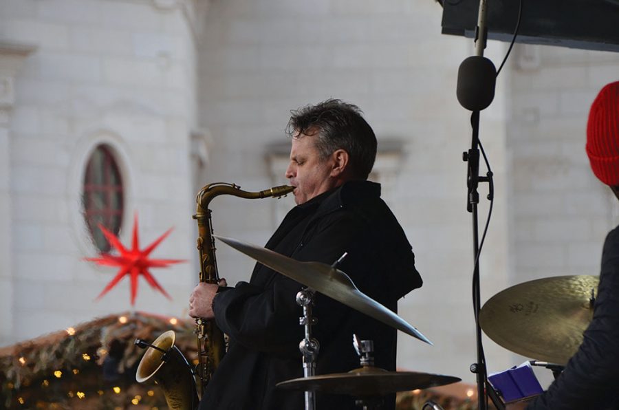 A saxophone player from Monika Herzig Acoustic Project plays “7 Rings” by Ariana Grande at the main stage at the Carmel Christkindlmarkt on Dec. 20, 2019. Monika Herzig Acoustic Project played from 4 to 6:45 p.m.