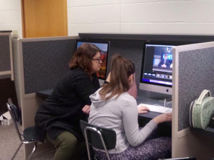 CHTV supervisor Brandy Ostojic assists Katherine Sehgal, CHTV staff member and senior, with editing. 