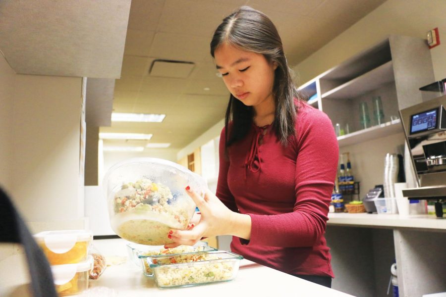 Junior Melissa Su divides her lunch into individual boxes to make it easier to bring in the morning. Su said she started focusing on having a more balanced diet last month.