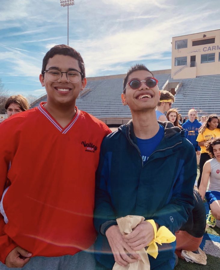 Eshan+Selvan%2C+Unified+track+athlete+and+senior%2C+poses+with+teammate+and+senior+Mike+Herod+during+a+meet+last+season.+Eshan+said+although+there+are+no+unified+sports+in+college+he+would+continue+to+participate+in+Special+Olympics+events.+