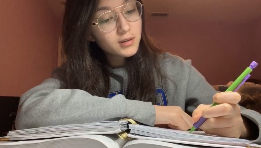 Junior Maylee OBrien takes notes as part of her e-learning study method. OBrien said that as junior year is important and she is close to college where she will have to manage on her own, she is trying to use this more unstructured time to build productive habits and life skills.