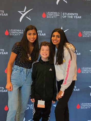 Janvi Bhatia, Carmel HOSA activities co-chair and junior, poses with her sister, sophomore Rhea Bhatia, and Ty Talatin at a Leukemia and Lymphoma Society event. This was pre-lockdown.