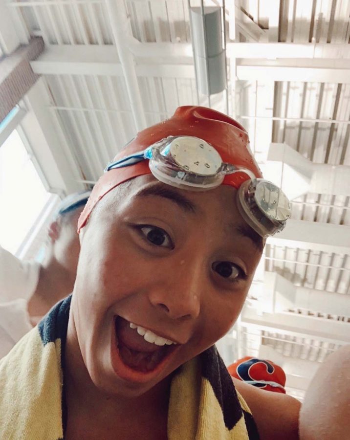 Swimmer and sophomore Analiese DeLeon posses in her swimming gear. Her team continues to exercise through Zoom.
