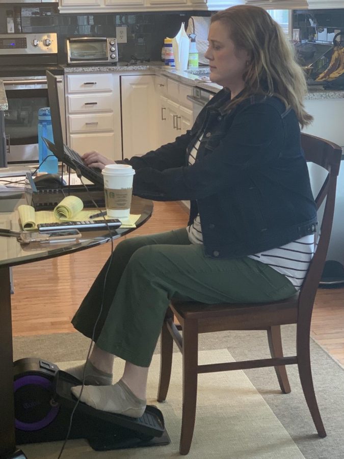 Attorney Kristina Wheeler runs her practice from the kitchen table while exercising with a stationary bicycle. For the past seven weeks, she has spent a minimum of five hours a day working from home. She bought the stationary bicycle because she figured it would be a “good way to exercise on a rainy day.”