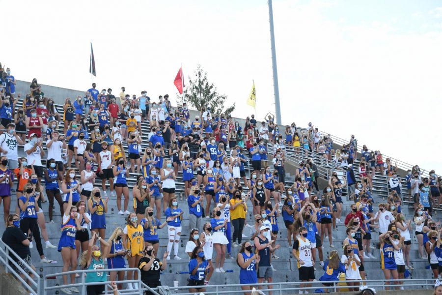 Many students gather on Friday, Aug. 28 to watch a home game for the Carmel Greyhounds against Cathedral. The Hounds lost the game 44-28; however, on Sept. 11, the Hounds won in a double overtime thriller 45-44 over Pike high school.Many students gathered to show energy, despite the 250 spectator limit set by the IHSAA. Athletic director Jim Inskeep said he finds players are becoming more and more accepting of the changes.