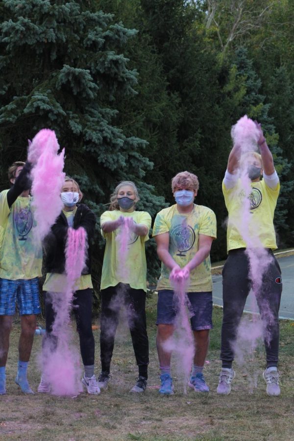 
From left to right, senior Max Mylott, senior Ella Hebert, sophomore Allie Wolf, senior Jacob Young and junior Zach Osborne throw colored paint powder in celebration of the end of the FT3K Color Run Race on Oct. 3. The Cabinet organized the event in order to raise money for Riley Children’s Hospital.