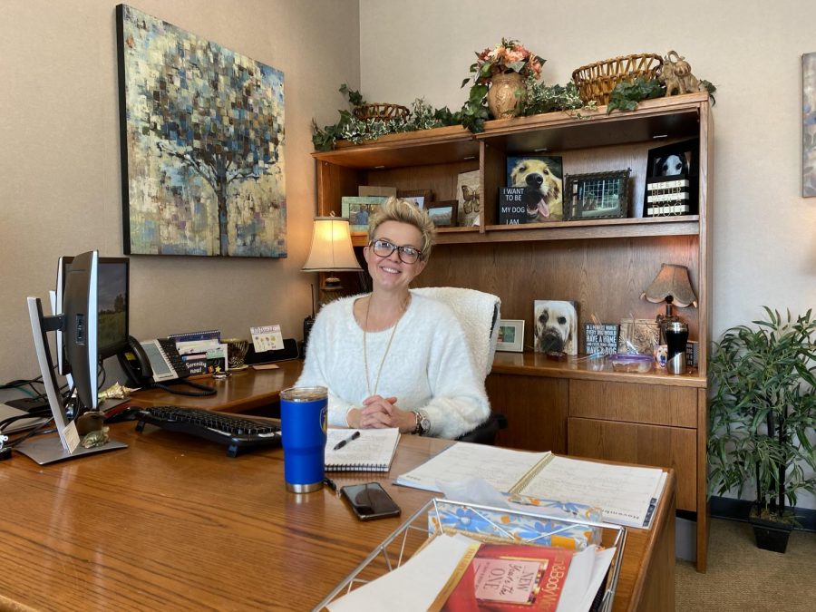 Associate Principal Karen McDaniel smiles from her desk on Nov. 16. McDaniel said that administration’s priority is to make sure that the school continues to be a safe environment for students during the COVID-19 pandemic so that some in-person instruction can remain in place.