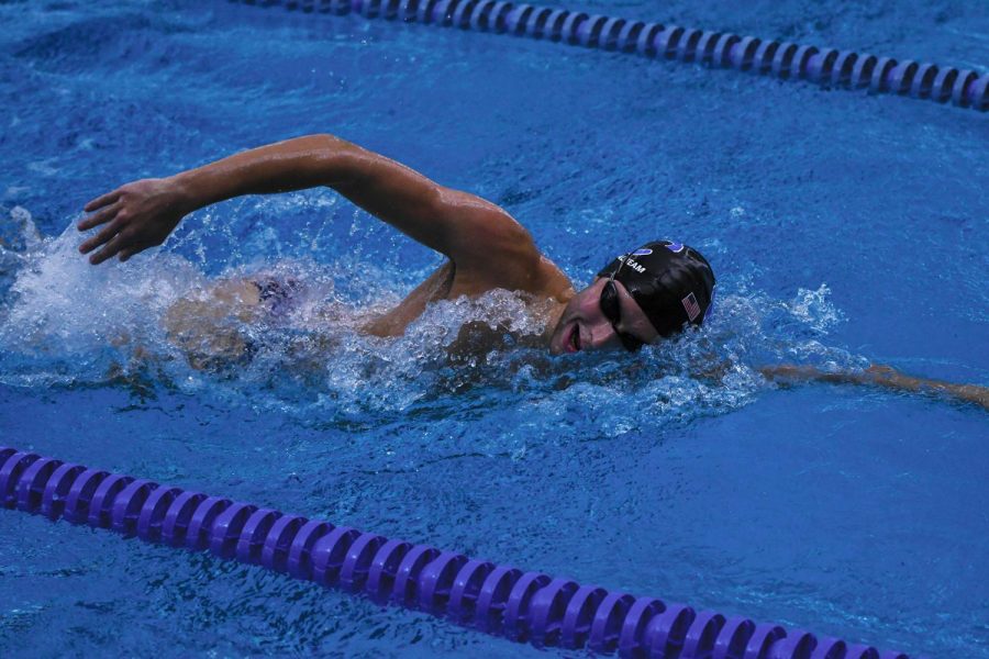 Griffin Hadley, varsity swimmer and senior, takes a breath during a practice swim. According to Hadley, his winter workouts are often more rigorous than his school ones.