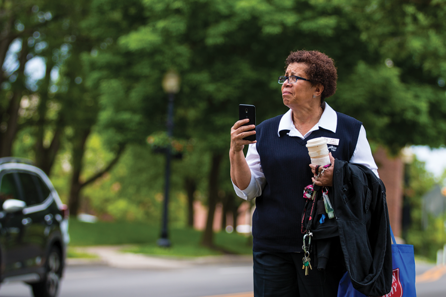 A woman holds her phone, taking a photo of a protest on June 1. The protest was led by sophomore Klay Gabriel, she said it was the first event she ever organized.