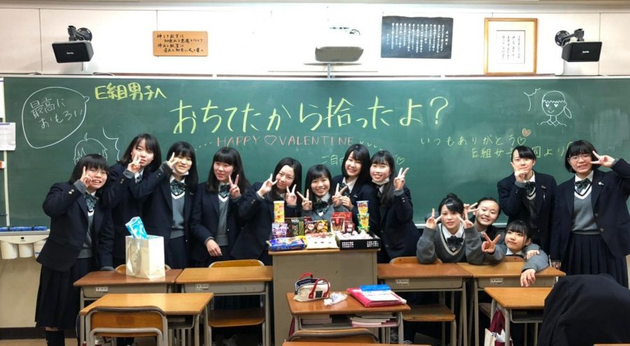12th-grader Aika Uda (fourth from left) poses with classmates and handmade candy on Valentines Day. Uda said it’s customary in Japan for women to give chocolates all the men in their lives.