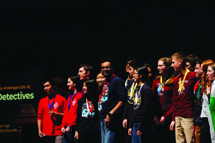 Senior Lalith Roopesh (6th from left) recieves a medal for one of his events at the University of Michigan Science Olympiad Invitational during his junior year. Roopesh said college tuitions were an important part of his considerations when he applied to colleges in late 2020, and Science Olympiad offers some scholarships to seniors