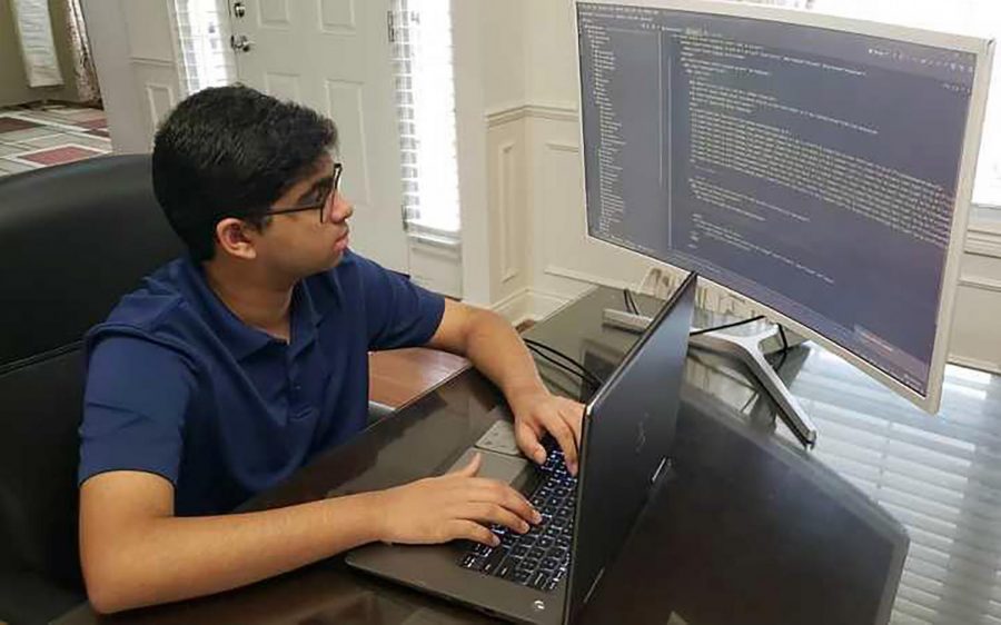 Junior Adi Ariyur works on his CHS Club Access app. He said a challenge he faced while coding the app was using a Django framework, because he had to implement multiple user types and handle administration, sponsor, and member logins.