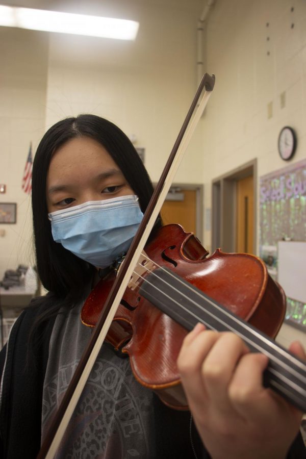 Freshman Carolyn Jia plays her instrument in preparation for ISSMA. She practices independently, in private lessons and in Concert Orchestra so she can perform well in ISSMA, even though it is virtual this year.
