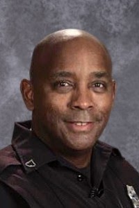School Resource Officer Scotty Moore poses for a headshot. Moore said the end of this school year is sad as he has not been able to make as many meaningful connections with students.