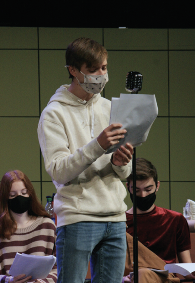 Theatre student and sophomore Theodore Curtis practices his lines and his part in preparation for the “Radio Mystery Theatre.” The cast held their show on Nov. 12 through Nov. 14. The radio show focused on a murder mystery and how the case was solved.