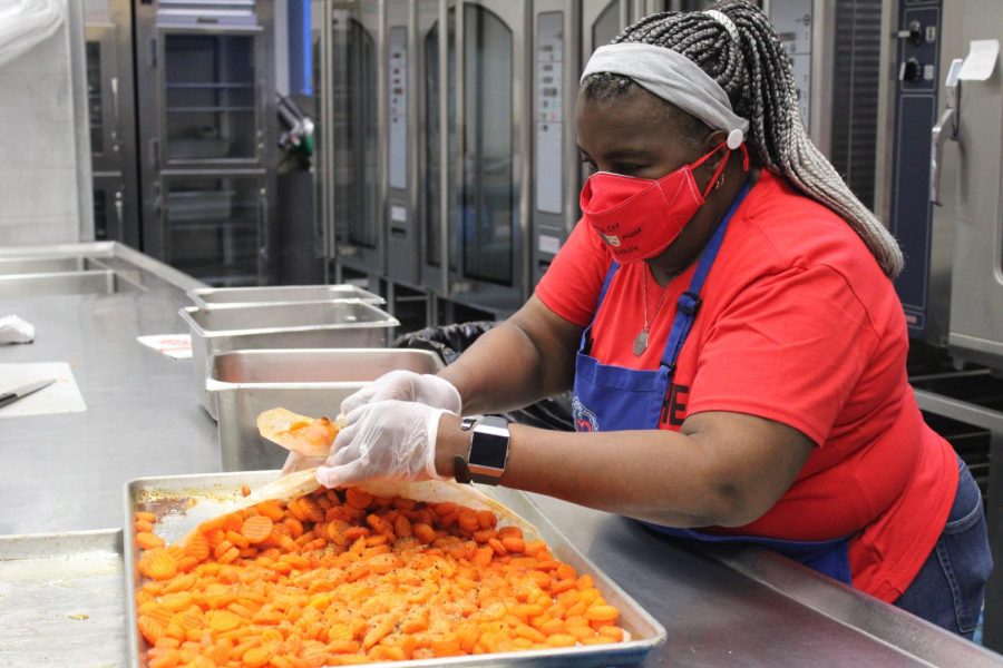 Cafeteria Worker Debbie Brown prepares a vegetable a la carte food choice. The CCS district will continue with the free meal plan for all students for the 2021-22 school year. 